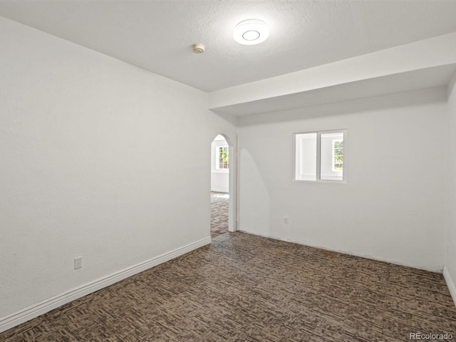 3853 S Malta St, Aurora, CO 80013 - carpeted spare room featuring arched walkways and a smoke detector