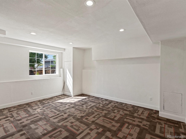 3853 S Malta St, Aurora, CO 80013 - below grade area with carpet, recessed lighting, baseboards, and a textured ceiling