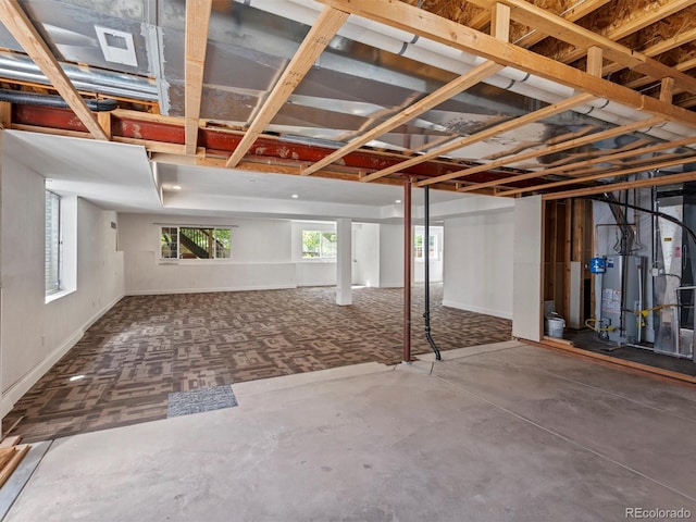 3853 S Malta St, Aurora, CO 80013 - basement featuring gas water heater and baseboards