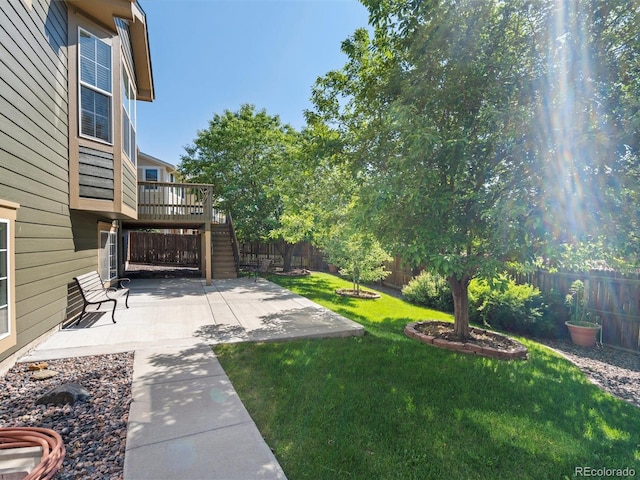 3853 S Malta St, Aurora, CO 80013 - view of yard featuring stairway, a patio area, and a wooden deck