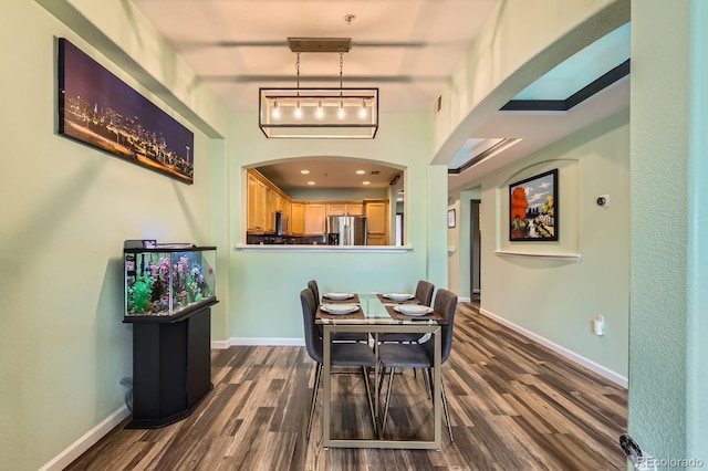 1727 N Pearl St Unit 107, Denver, CO 80203 - dining space with dark wood-style floors and baseboards