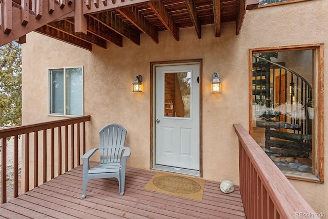 4236 Tranquil Way, Crestone, CO 81131 - view of exterior entry with a deck and stucco siding