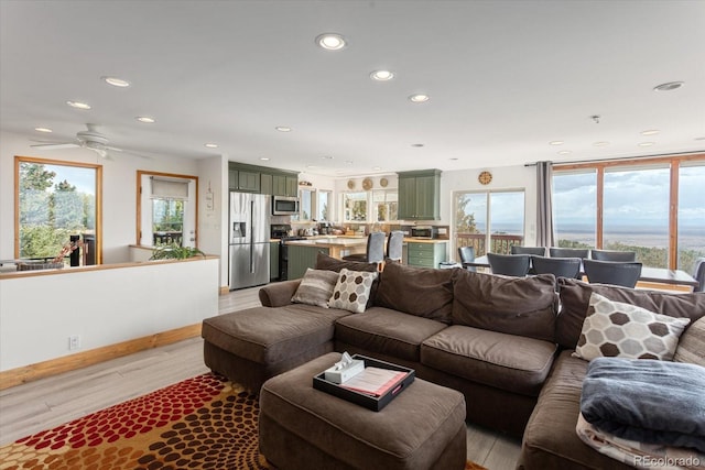 4236 Tranquil Way, Crestone, CO 81131 - living room with light wood-type flooring, recessed lighting, and a ceiling fan