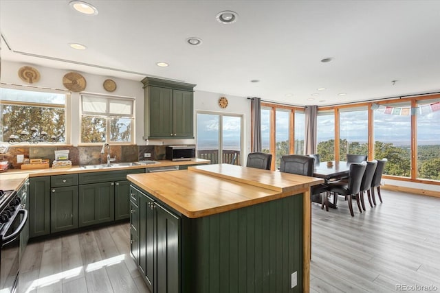 4236 Tranquil Way, Crestone, CO 81131 - kitchen with a sink, gas stove, plenty of natural light, and butcher block counters