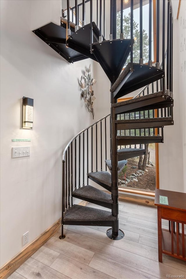 4236 Tranquil Way, Crestone, CO 81131 - stairway featuring baseboards and wood finished floors