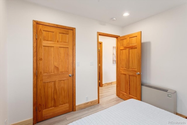 4236 Tranquil Way, Crestone, CO 81131 - bedroom featuring light wood-style floors, baseboards, and recessed lighting