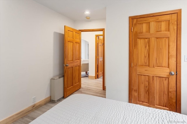 4236 Tranquil Way, Crestone, CO 81131 - bedroom featuring light wood-type flooring, recessed lighting, and baseboards
