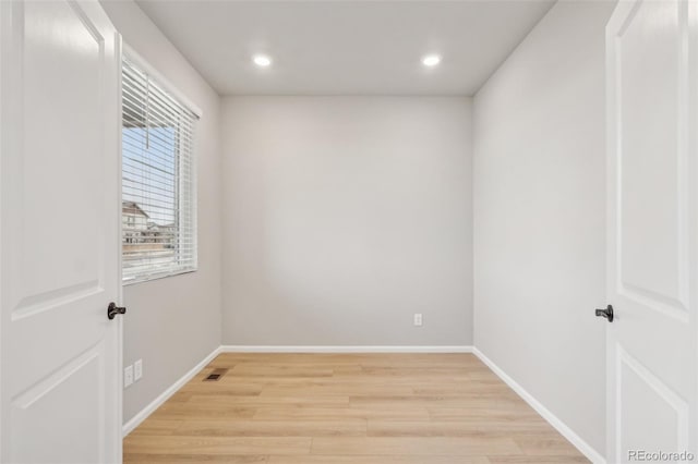 empty room with light wood-type flooring