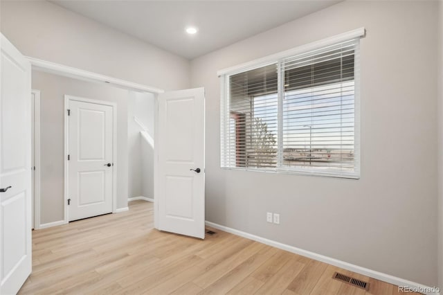 unfurnished bedroom with light hardwood / wood-style floors