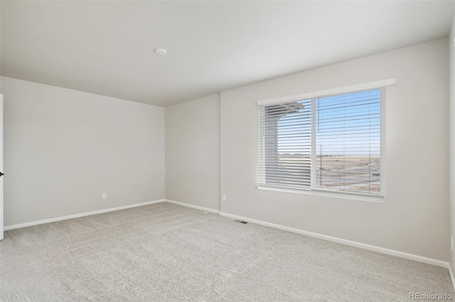 empty room featuring carpet floors