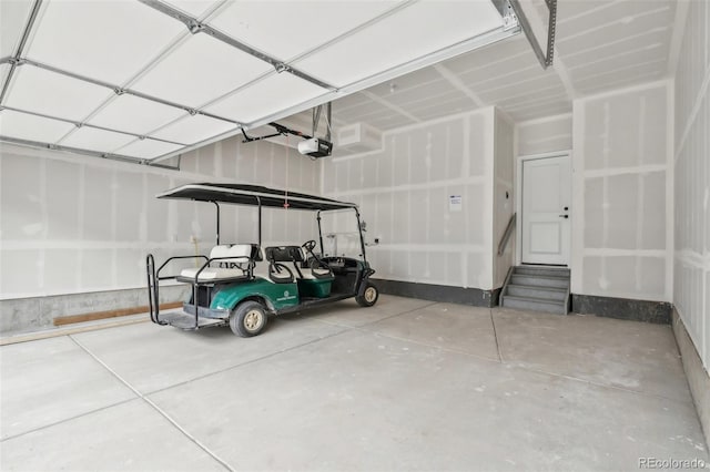 garage with a garage door opener and a carport