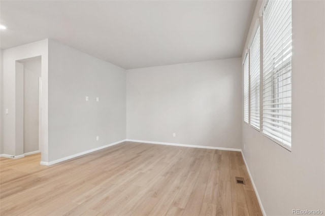 spare room with light hardwood / wood-style floors