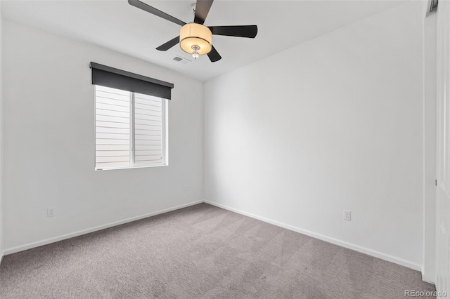 empty room featuring carpet flooring and ceiling fan