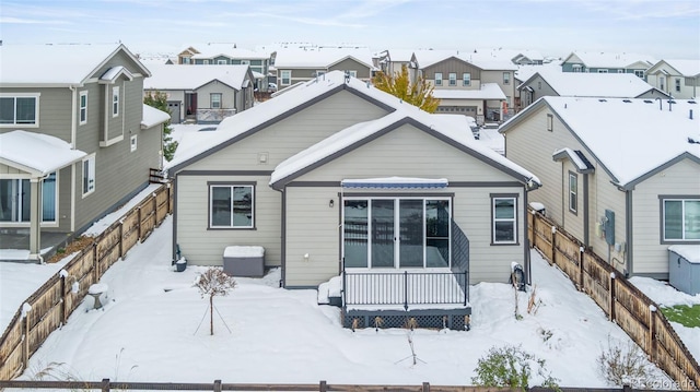 view of snow covered house