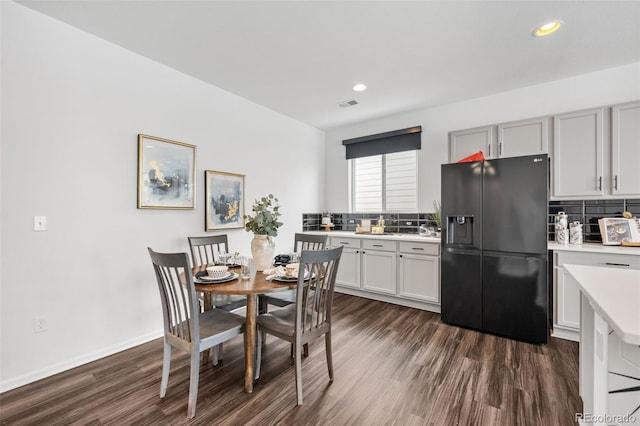 dining area featuring dark hardwood / wood-style flooring