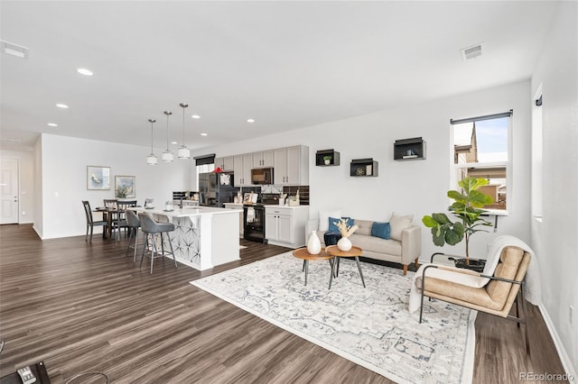 living room with dark wood-type flooring