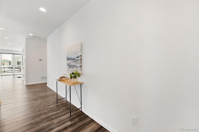 hallway featuring dark hardwood / wood-style floors