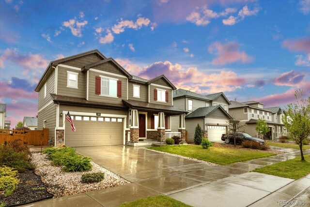 craftsman inspired home featuring stone siding, driveway, a garage, and covered porch