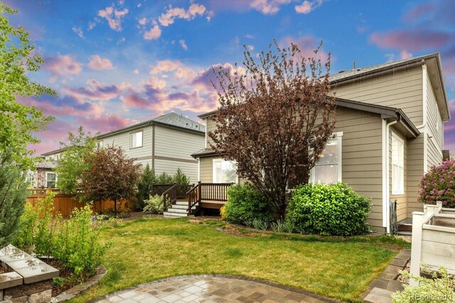 view of front of home featuring a deck and a patio