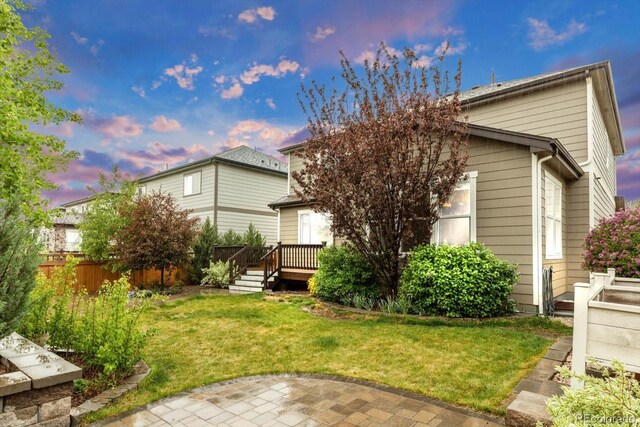 rear view of house with a deck and a patio area
