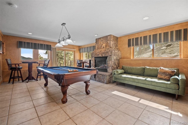 rec room with light tile patterned floors, pool table, recessed lighting, and a fireplace