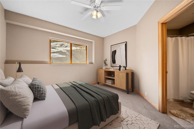 bedroom with light carpet, baseboards, and a ceiling fan