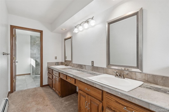 bathroom with a baseboard heating unit, walk in shower, vanity, and tile patterned floors