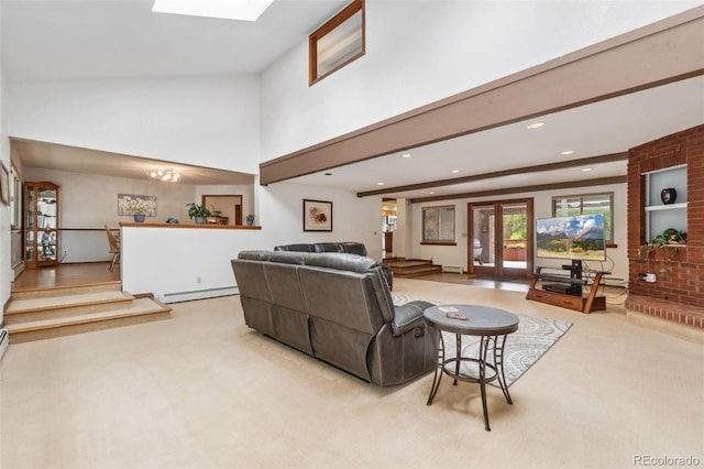 carpeted living room with vaulted ceiling with skylight, french doors, and a baseboard heating unit