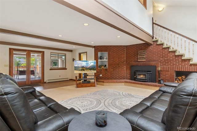 living room featuring beamed ceiling, french doors, baseboard heating, and brick wall