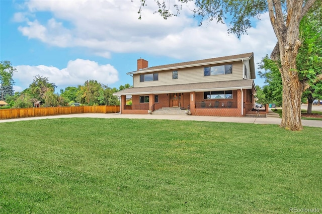 10101 W 72nd Ave, Arvada, CO 80005 - rear view of house with covered porch, a chimney, and brick siding