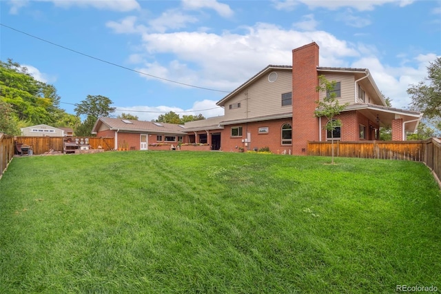 10101 W 72nd Ave, Arvada, CO 80005 - rear view of property with brick siding and a chimney