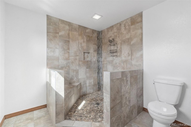 10101 W 72nd Ave, Arvada, CO 80005 - bathroom with toilet, a walk in shower, and baseboards