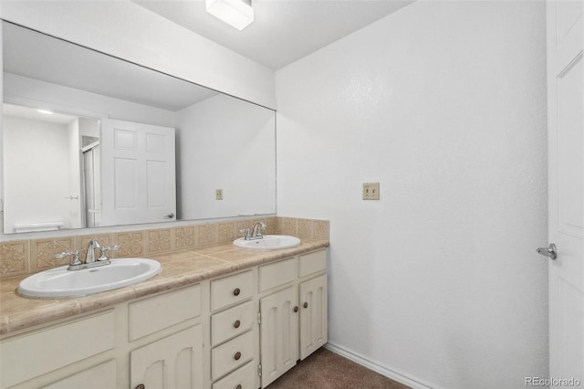 10101 W 72nd Ave, Arvada, CO 80005 - bathroom with double vanity, an enclosed shower, and baseboards