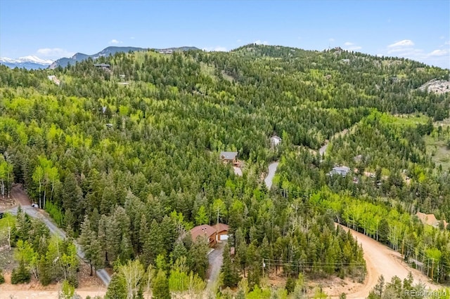 11457 Nancys Dr, Conifer, CO 80433 - aerial view of a heavily wooded area and a mountain backdrop