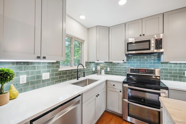 11457 Nancys Dr, Conifer, CO 80433 - kitchen featuring stainless steel appliances, light countertops, decorative backsplash, and recessed lighting