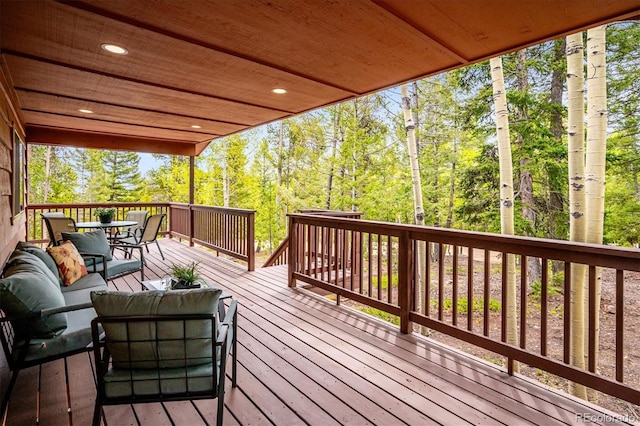 11457 Nancys Dr, Conifer, CO 80433 - wooden terrace featuring an outdoor hangout area