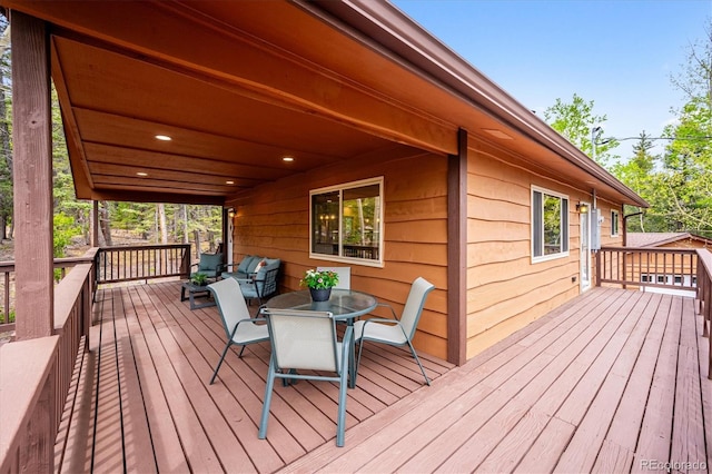 11457 Nancys Dr, Conifer, CO 80433 - wooden deck with outdoor dining area
