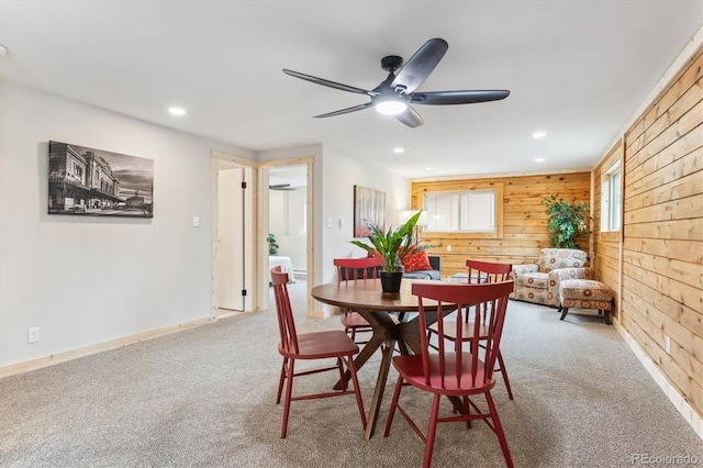 11457 Nancys Dr, Conifer, CO 80433 - dining area with wooden walls, a ceiling fan, carpet floors, and recessed lighting