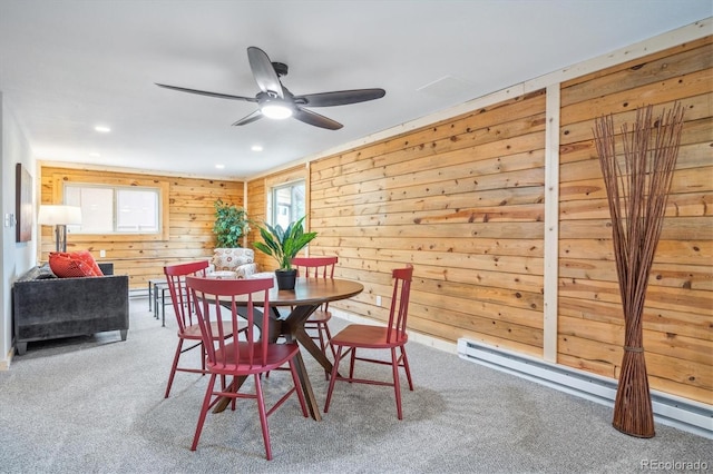 11457 Nancys Dr, Conifer, CO 80433 - carpeted dining area featuring a ceiling fan, a baseboard radiator, wood walls, and recessed lighting