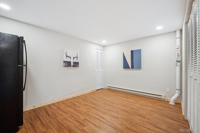 11457 Nancys Dr, Conifer, CO 80433 - spare room featuring a baseboard radiator, wood finished floors, and recessed lighting
