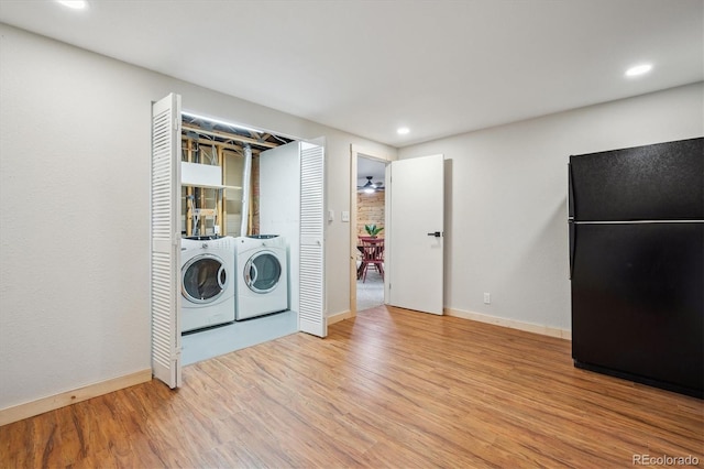 11457 Nancys Dr, Conifer, CO 80433 - laundry room with washing machine and clothes dryer, wood finished floors, and recessed lighting