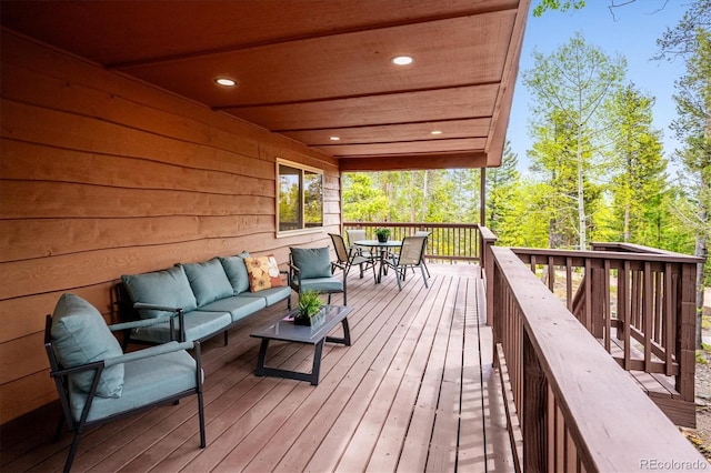 11457 Nancys Dr, Conifer, CO 80433 - deck featuring outdoor dining space and outdoor lounge area