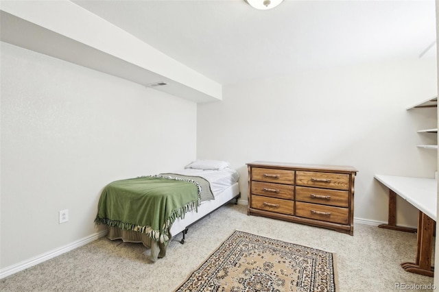 bedroom with light carpet, visible vents, and baseboards