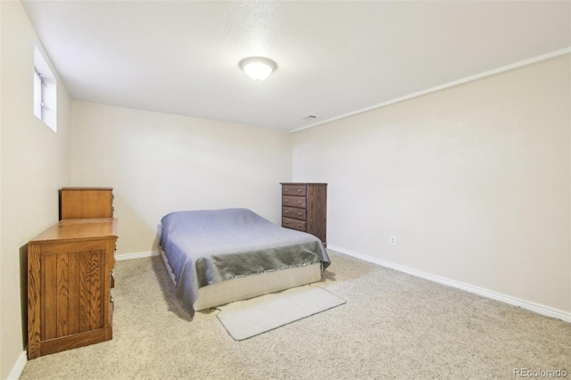 carpeted bedroom featuring visible vents and baseboards