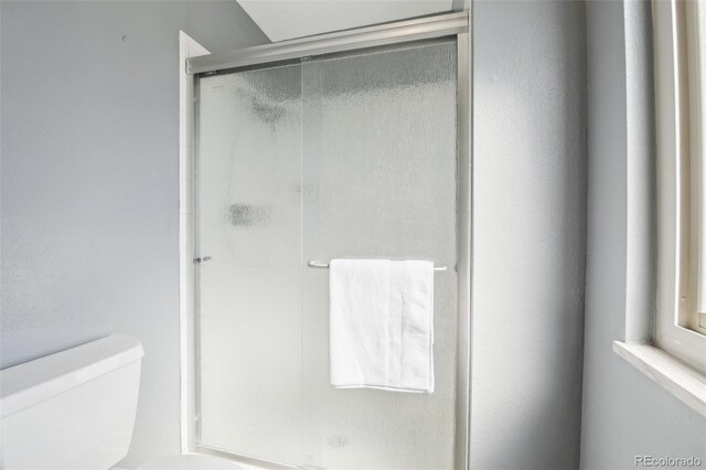 12097 E Mexico Ave, Aurora, CO 80012 - full bathroom with toilet and a shower stall