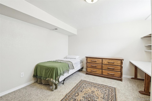 bedroom featuring light colored carpet and baseboards