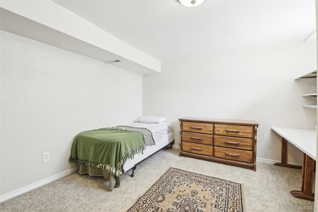 12097 E Mexico Ave, Aurora, CO 80012 - bedroom featuring light colored carpet and baseboards