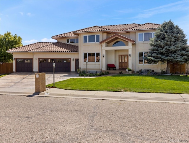 view of front facade featuring a garage, concrete driveway, a front lawn, and stucco siding