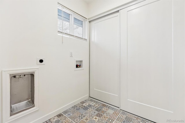 washroom featuring hookup for a washing machine, baseboards, hookup for an electric dryer, and laundry area