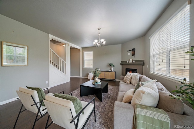 1181 W 170th Ave, Broomfield, CO 80023 - living room with dark wood-style flooring, a chandelier, stairway, and baseboards